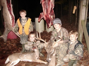Four kids and their deer